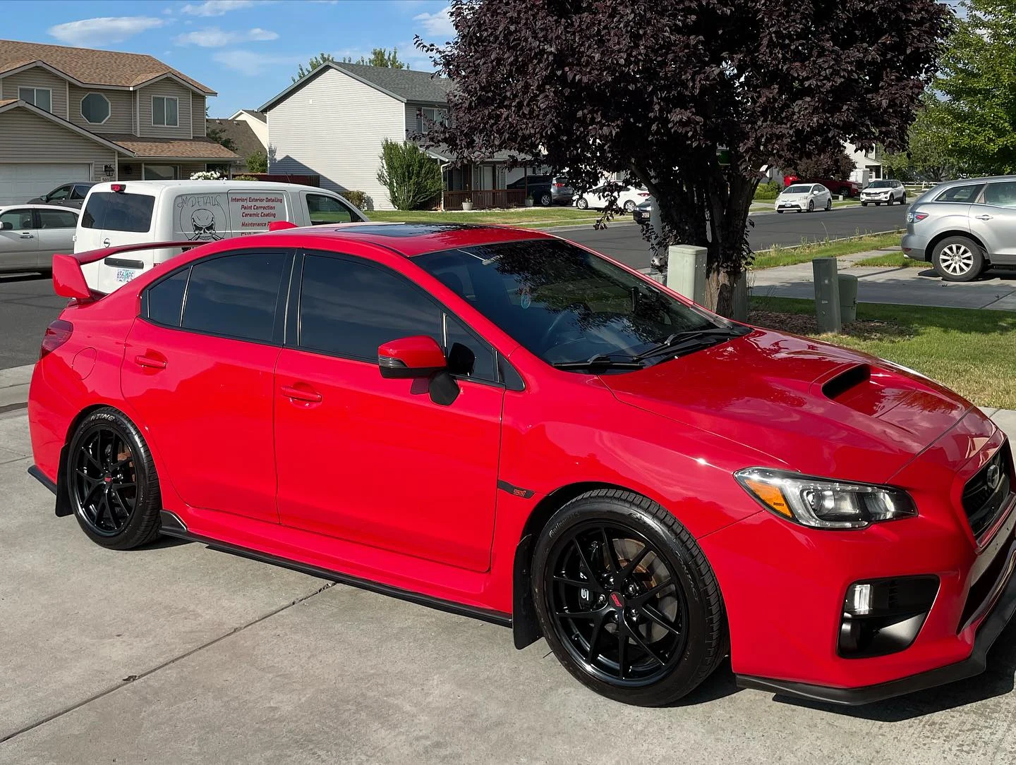 Finished red Subaru photographed after detailing