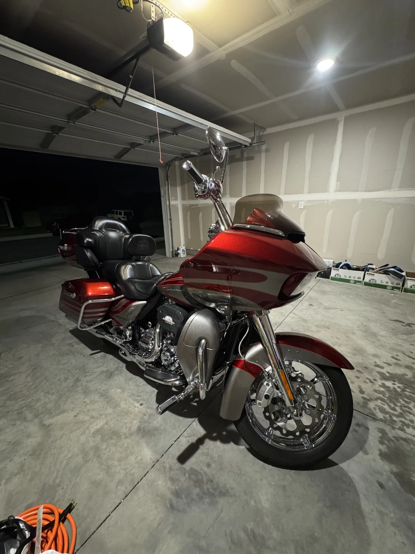 Clean red and silver touring motorcycle photographed after detailing